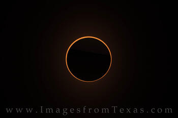 The moon blocks the sun in an annular eclipse.