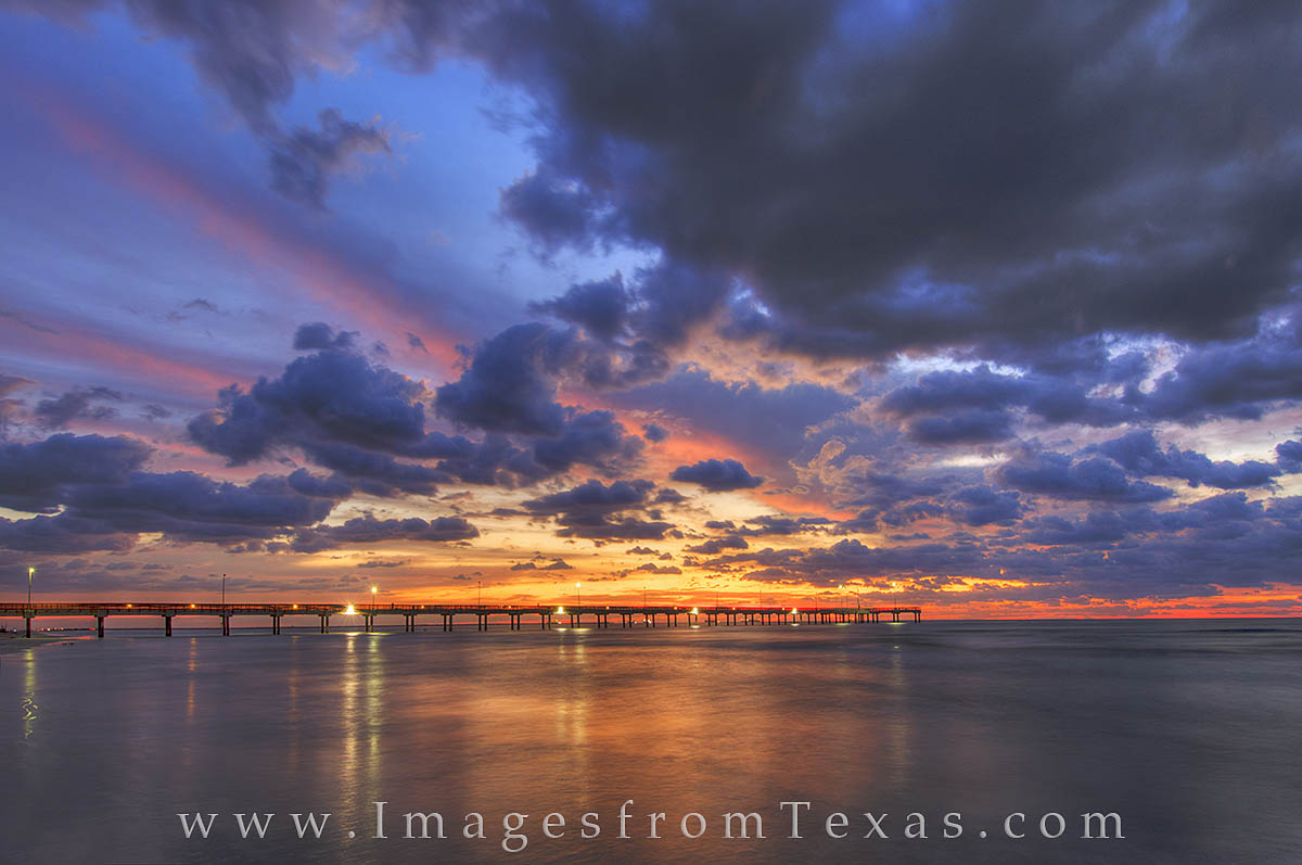 Caldwell Pier 12, Port Aransas Amazing light welcomes the morning in Port Aransas, Texas. Taken along the beach near Caldwell Pier, this photograph shows a...