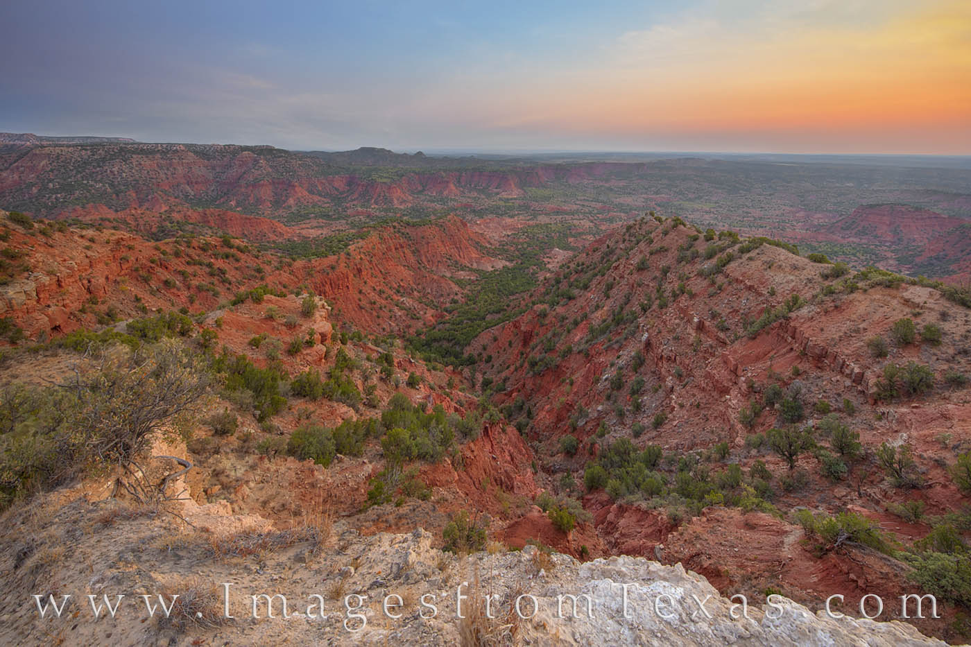 Caprock Morning from the Haynes Ridge Overlook 2 The red and orange of the Haynes Ridge Overlook seems to glow in the early morning light. Far below, the valley floor is 600...