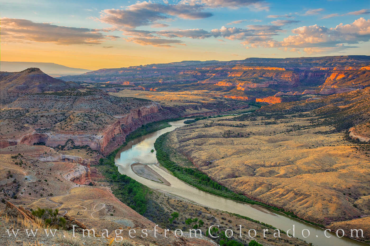 Colorado River at Sunrise 717-2 From about 300 feet above the cliffs, this aerial photograph looks down on the Colorado River in Horsethief Canyon. Far below...