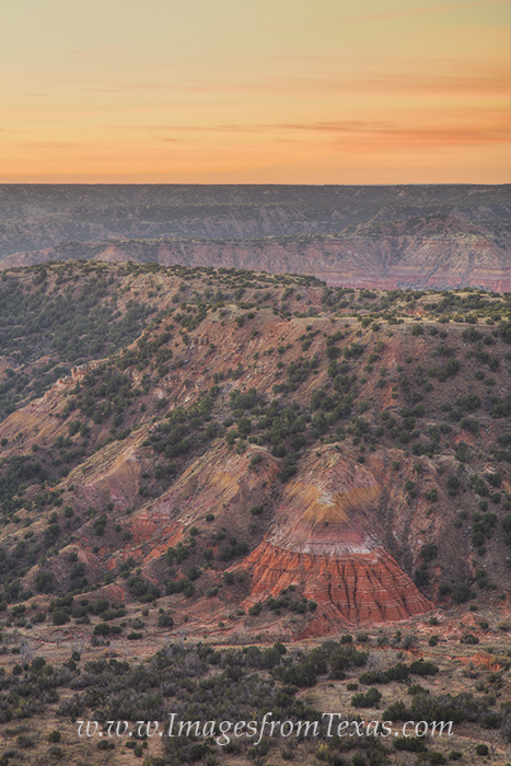 Colors of Palo Duro Canyon Sunrise As the sun begins to make its appearance over the rocky Texas landscape, the colors of red and orange rock, layers dating back...