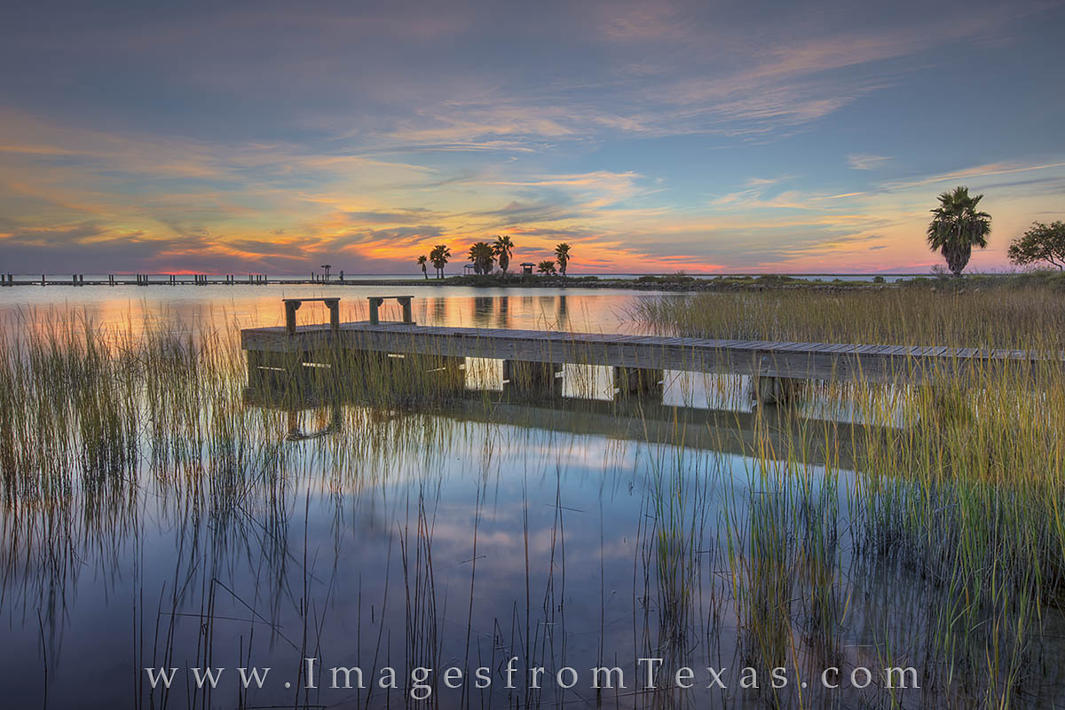 Copano Bay Sunset, Rockport Texas 3 A quiet evening falls across the waters of the Texas Gulf Coast. Here at Copano Bay, a small pier reaches across the grassy shoreline...