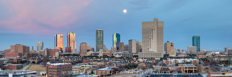 Fort Worth Texas Panorama 2 Evening comes to downtown Fort Worth, Texas, as the clouds turn a soft pink with the sun fading in the western sky.