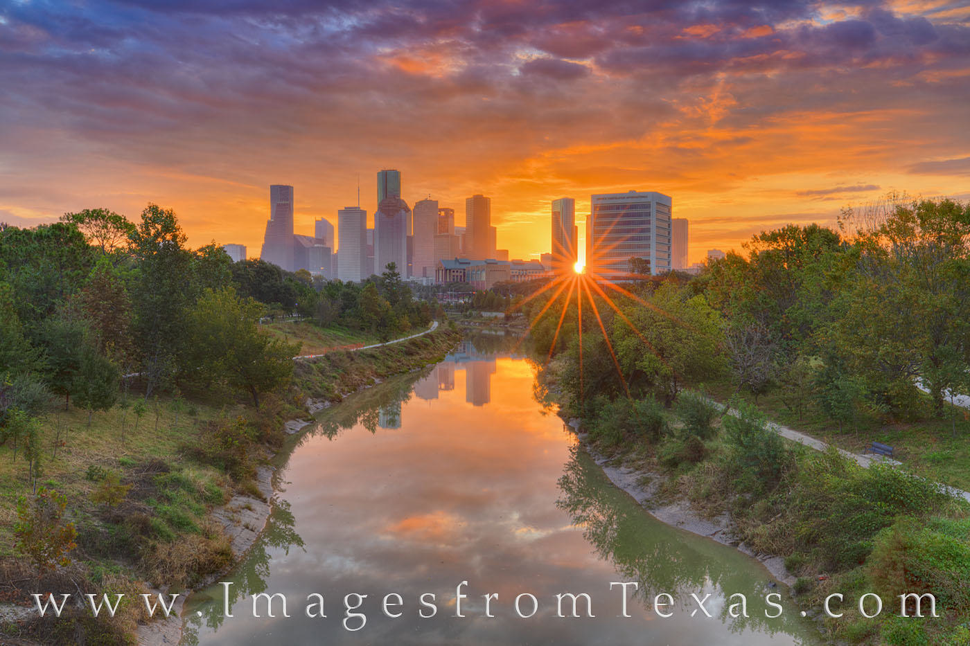 Houston Skyline Sunrise 118-2 The warm glow of sunrise shines through the highrises of downtown Houston, Texas, on a cool November morning. Over the skyline...