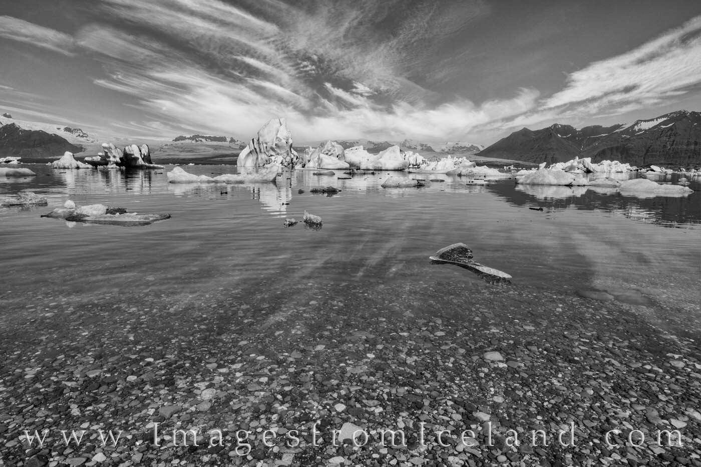 Jökulsárlón Bay in Black and White 1 Icebergs from Breiðamerkurjökull Glacier float under a summer sky and clouds in this black and white image from south Iceland...
