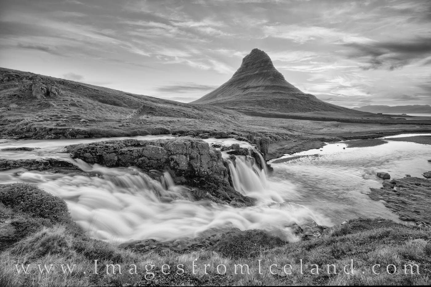 Kirkjufell Morning in Black and White 1 A little before sunrise, the skies above Kirkjufell Mountain show some soft pastel designs. The water of Kirkjufellfoss flowed...