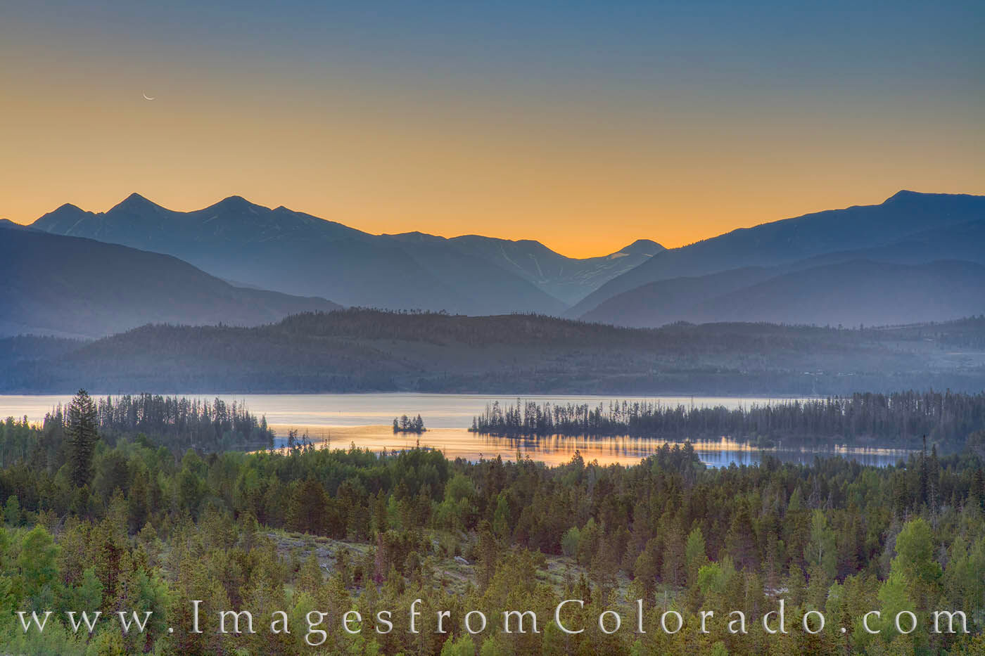 Lake Dillon Morning 1 A crescent moon rises over Lake Dillon Reservoir near Frisco, Colorado. The morning was calm and cold despite being in June....