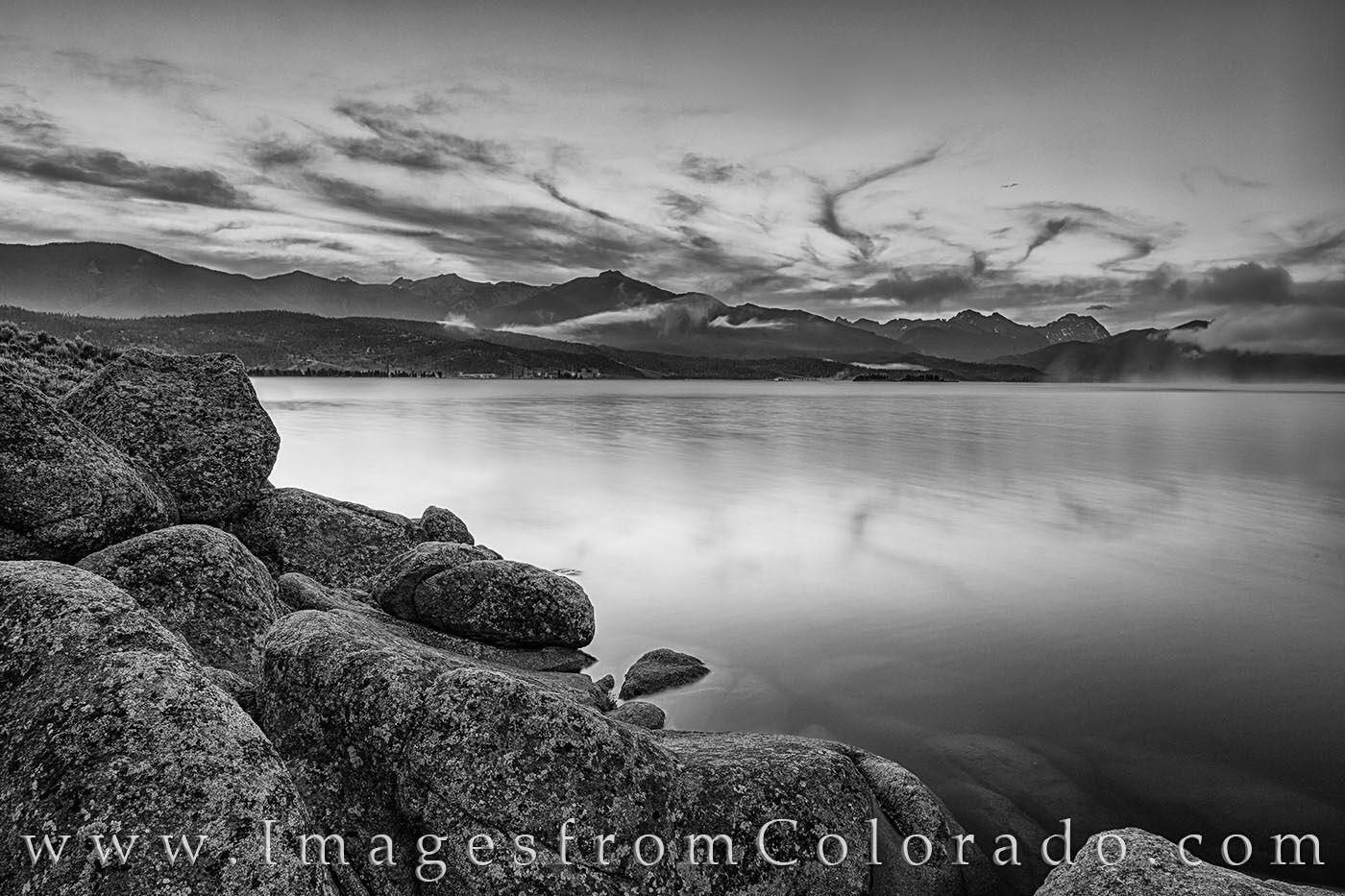 Lake Granby before Sunrise Black and White 721-2 On a cold summer morning after a night of rain, the remaining clouds reach up into the sky over Lake Granby in this black and...