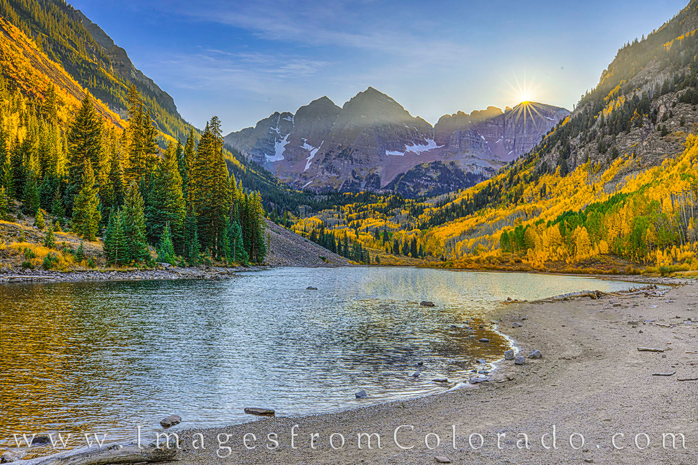 Maroon Bells Autumn Sunset 103-1 On an unusually quiet fall evening, the sun sets over the Elks Range. Maroon and North Maroon Peaks, both 14ers, rest just to...
