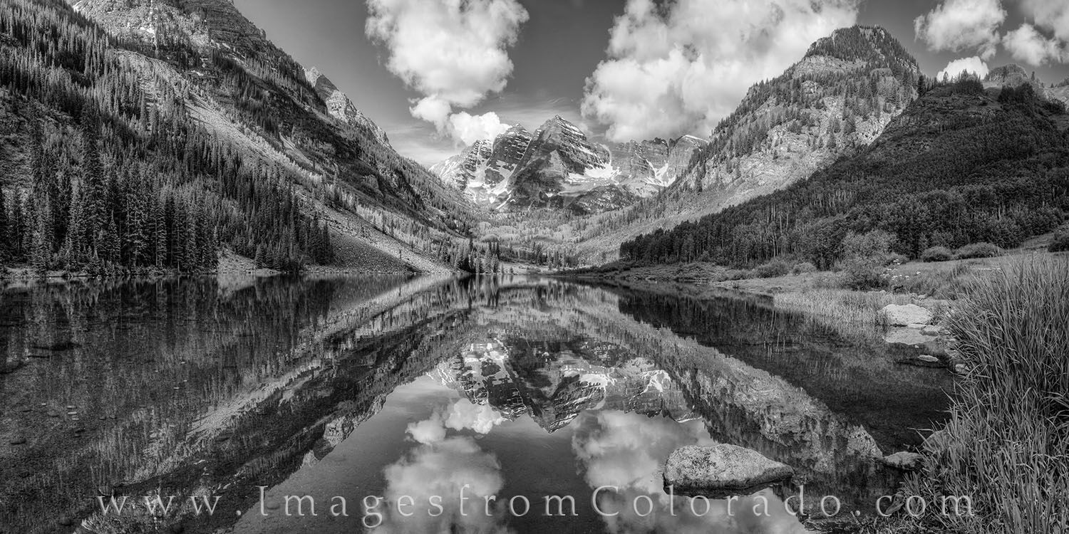 Maroon Bells Black and White Panorama 1 On a perfect summer morning, Maroon Peak and North Maroon Peak reflected in the calm, still water of Maroon Lake in this black...