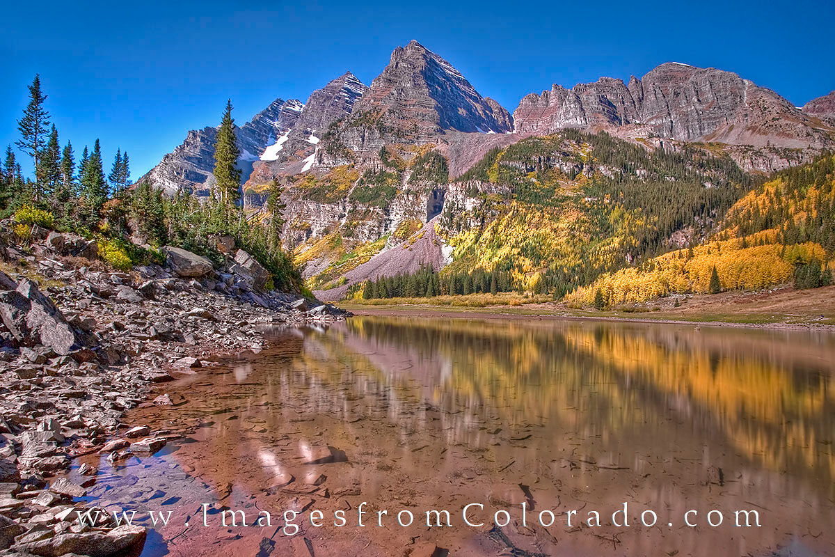Maroon Bells Reflection from Crater Lake 1 The Maroon Bells near Aspen, two of Colorado's 14,000' peaks, are arguably the most photographed peaks in Colorado. Most of the...