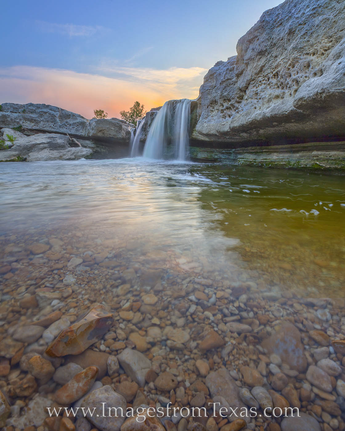 McKinney Falls Sunset 520-4 The clear water from Onion Creek pours over the small cascade of Lower Falls in McKinney Falls State Park. This nature sanctuary...