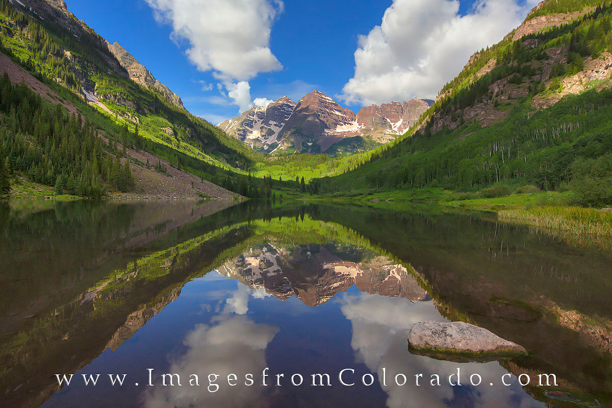 Reflections of the Maroon Bells 2 I arrived at Maroon Lake very early this morning only to find the two prominent peaks, both 14,000' tall, shrouded in clouds....