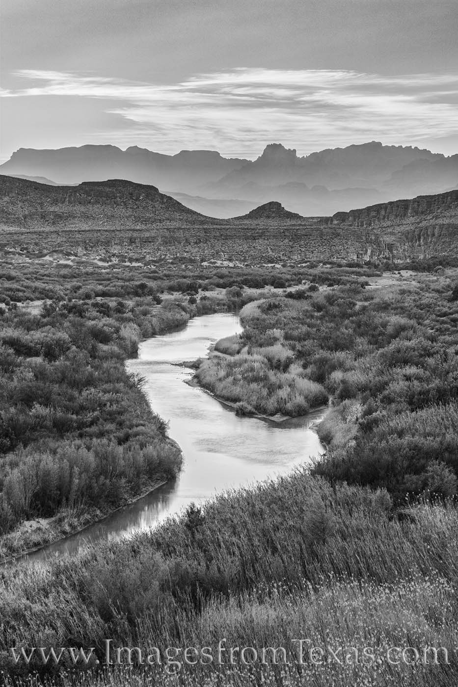 Rio Grande in in Black and White 312-1 The Rio Grande flows eastward toward the Gulf of Mexico in this black and white photograph from Big Bend National Park. The rugged...