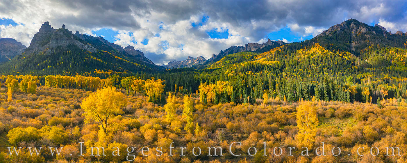 San Juan Autumn Panorama 104-1 This Autumn panorama comes from the Cimarron area in the San Juan Mountains on the eastern side of Owl Creek Pass. The oak and...