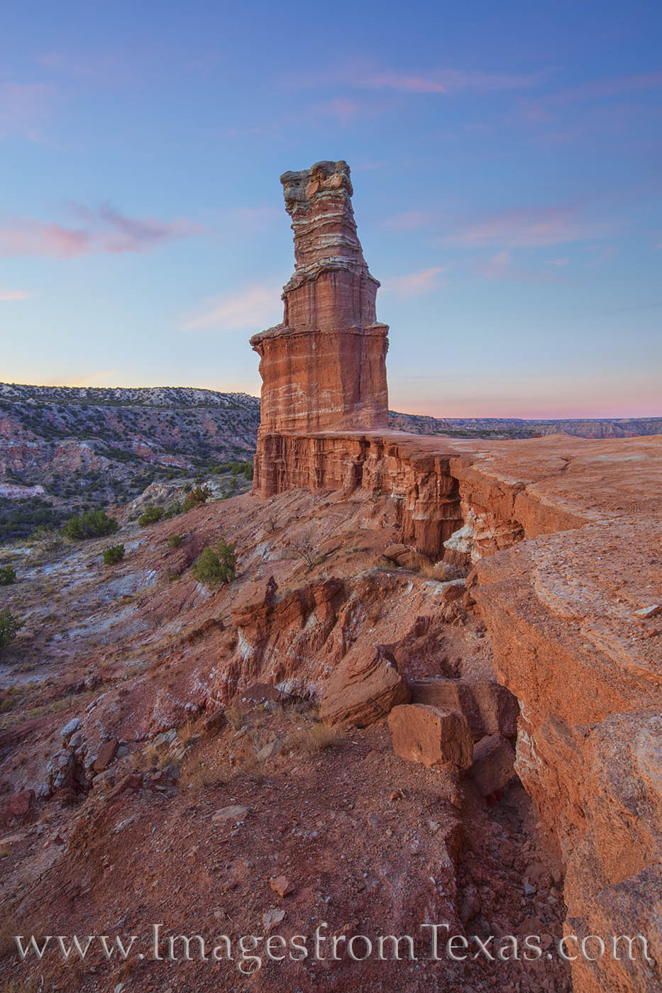 The Lighthouse 1124-1 From a rocky trail just west of the iconic Lighthouse hoodoo in Palo Duro Canyon, this view shows the soft pastel colors of a...