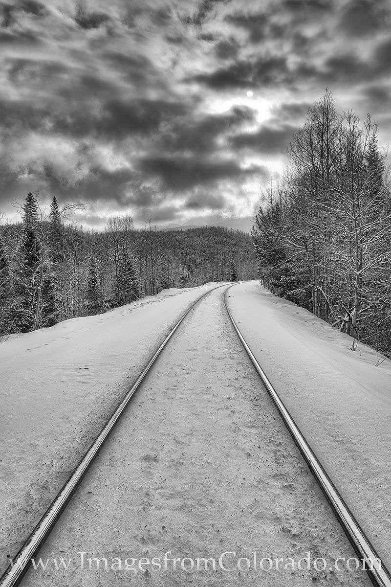 Train Tracks in Snow Black and White 1228-2 This black and white photograph comes from just outside the resort town of Winter Park, Colorado. These train tracks lead to...