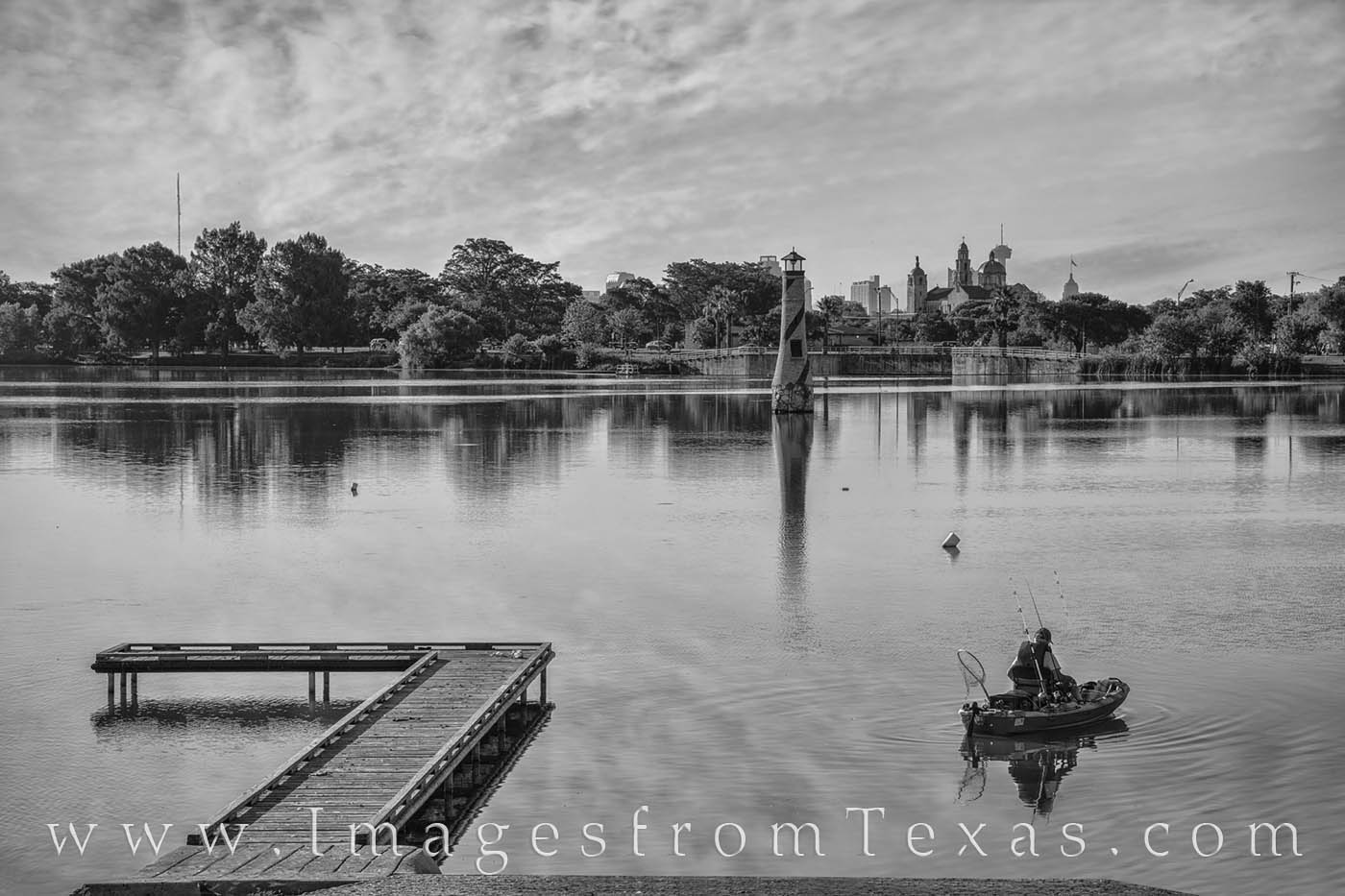 Woodlawn Lake - San Antonio 1 Black and White From Woodlawn Lake just west of San Antonio, a fisherman sets off for a morning excursion on a warm summer morning.